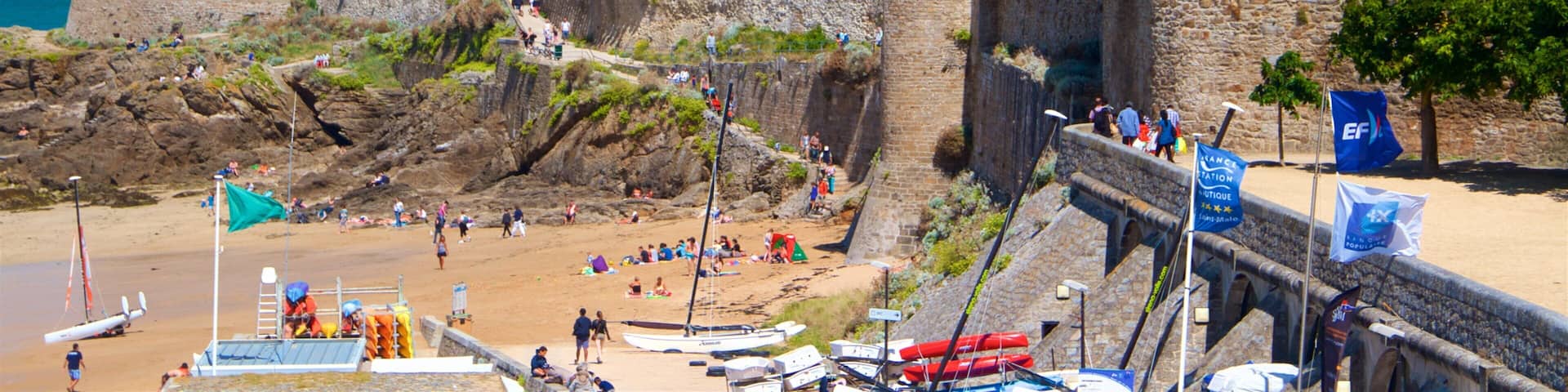 Ille-et-Vilaine featuring a sandy beach, a coastal town and heritage elements