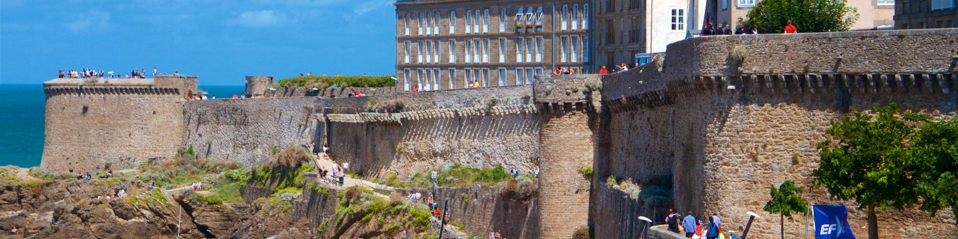 Ille-et-Vilaine featuring a sandy beach, a coastal town and heritage elements