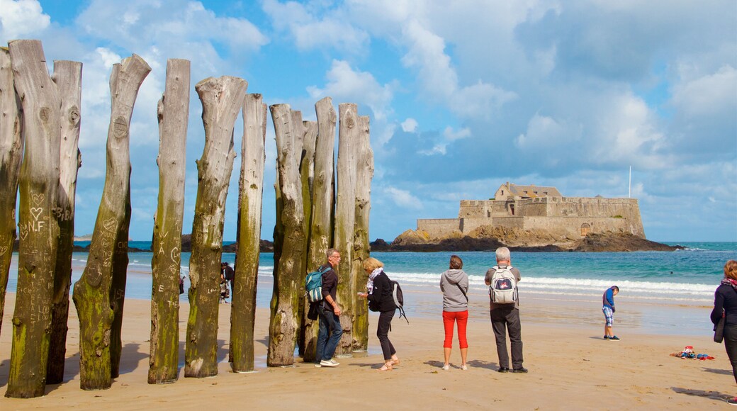 Ille-et-Vilaine featuring a beach and general coastal views as well as a small group of people