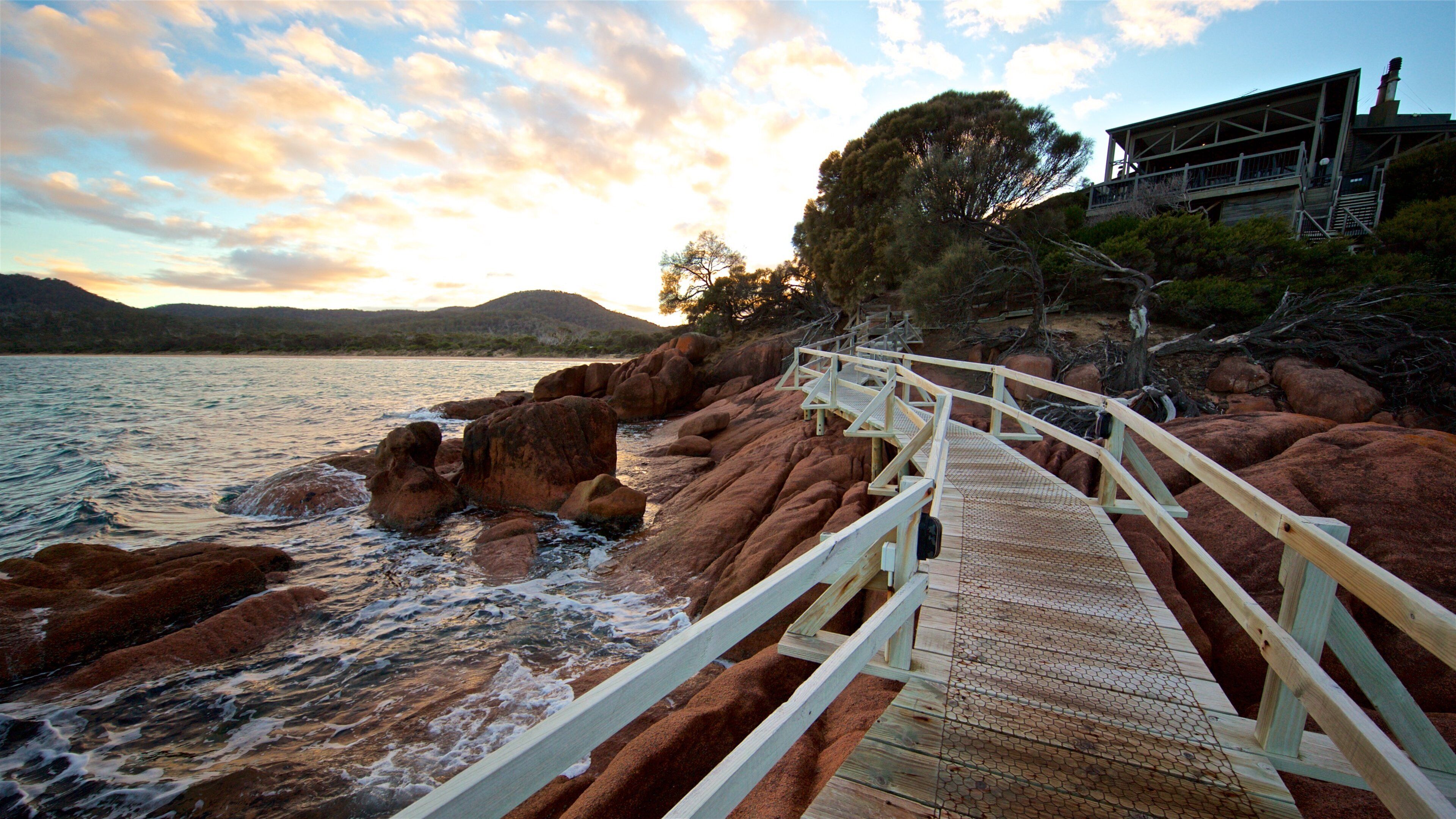 Coles Bay showing general coastal views, a sunset and rugged coastline