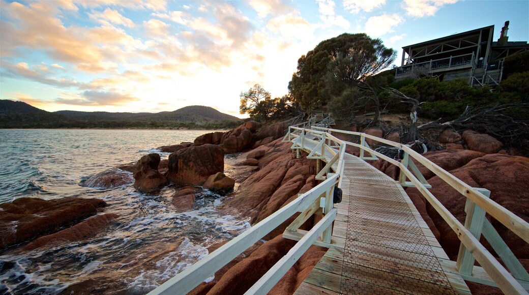 Coles Bay showing general coastal views, a sunset and rugged coastline
