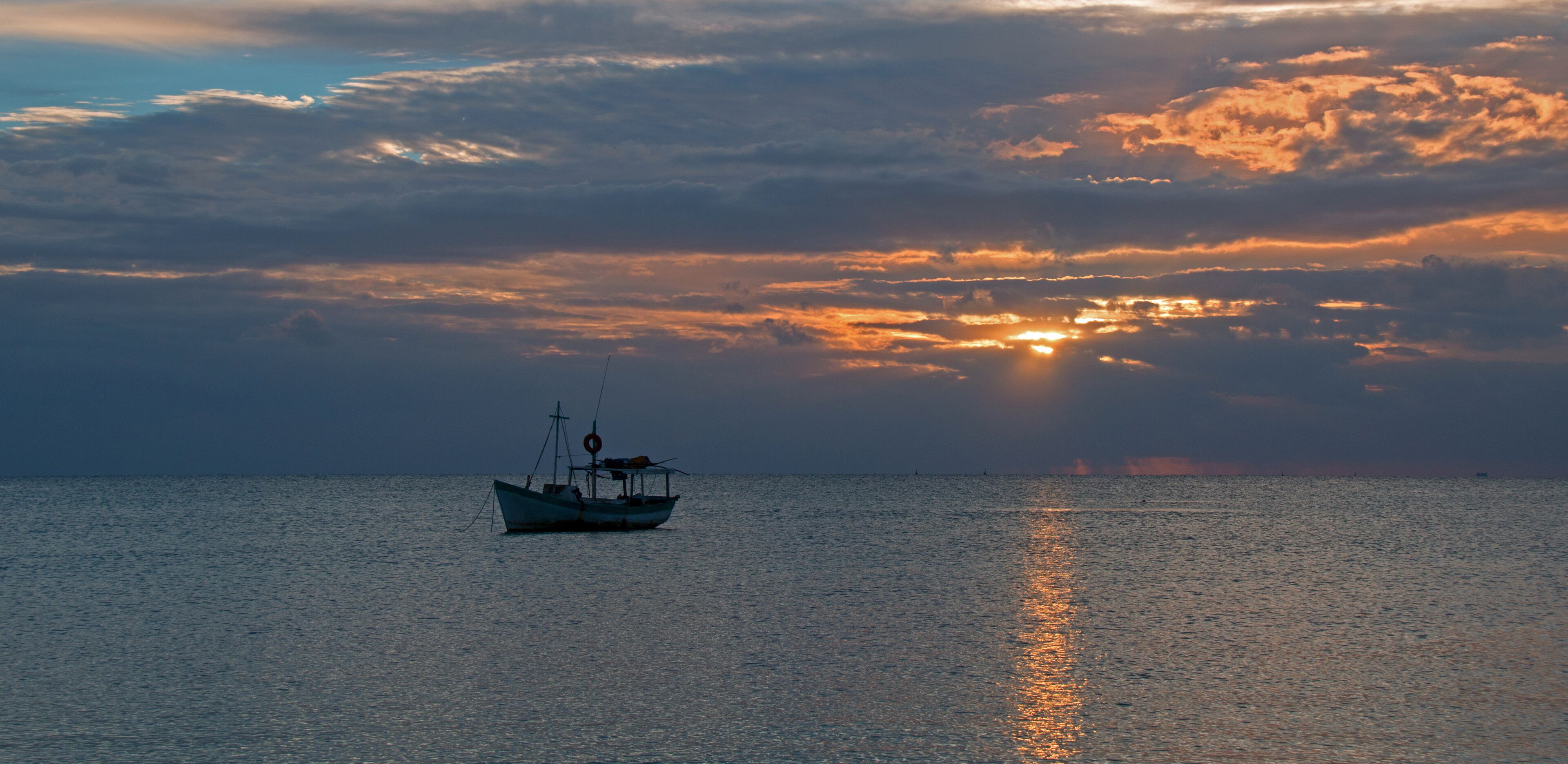 Fishing boat in Puerto Juarez at sunrise