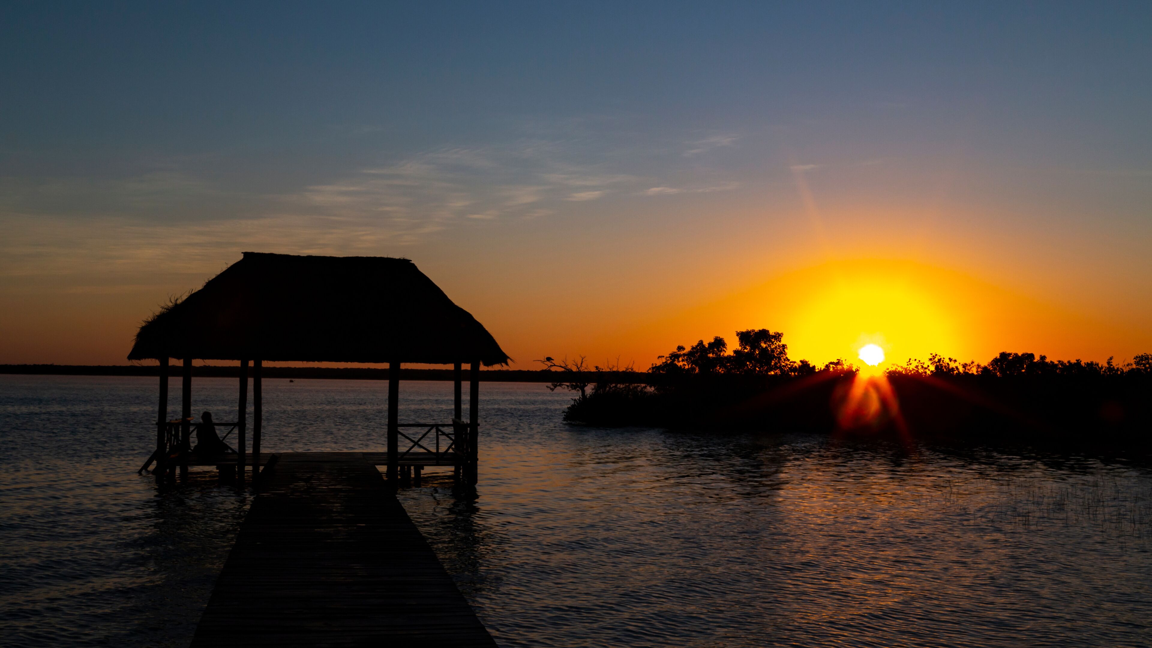 beautiful sunrise, meditation in the lagoon of the seven colors, in Bacalar, Quintana Roo, Mexico.