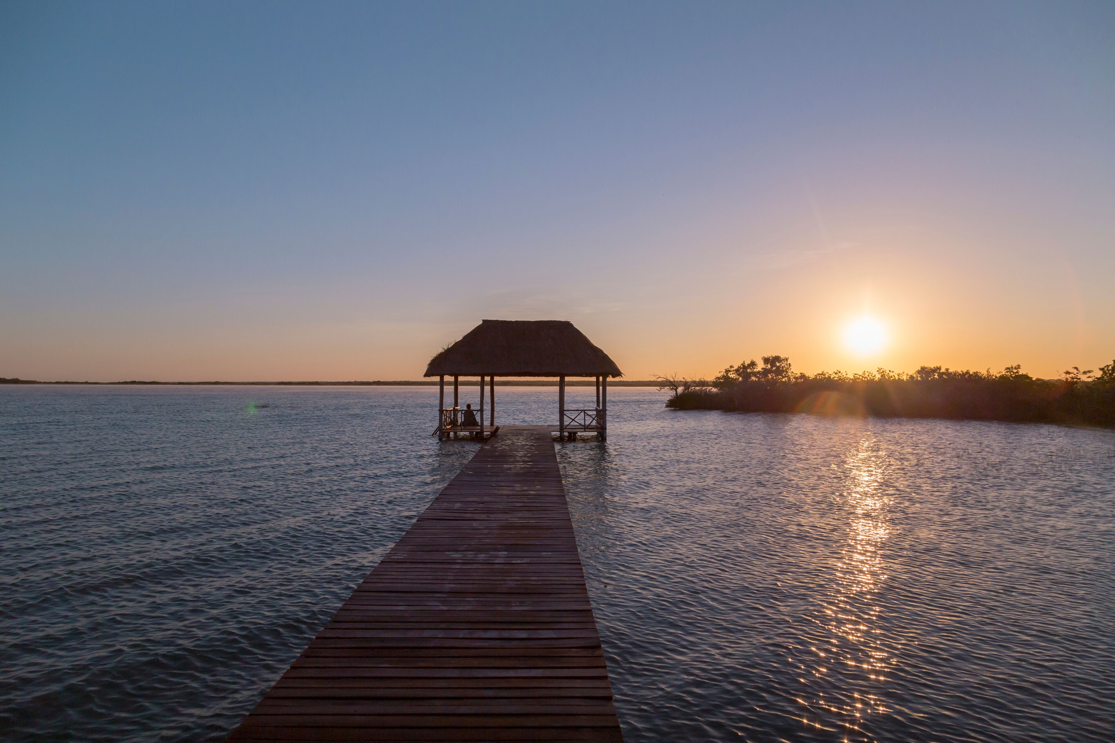 Sunrise, meditation in the lagoon of the seven colors, in Bacalar, Quintana Roo, Mexico.