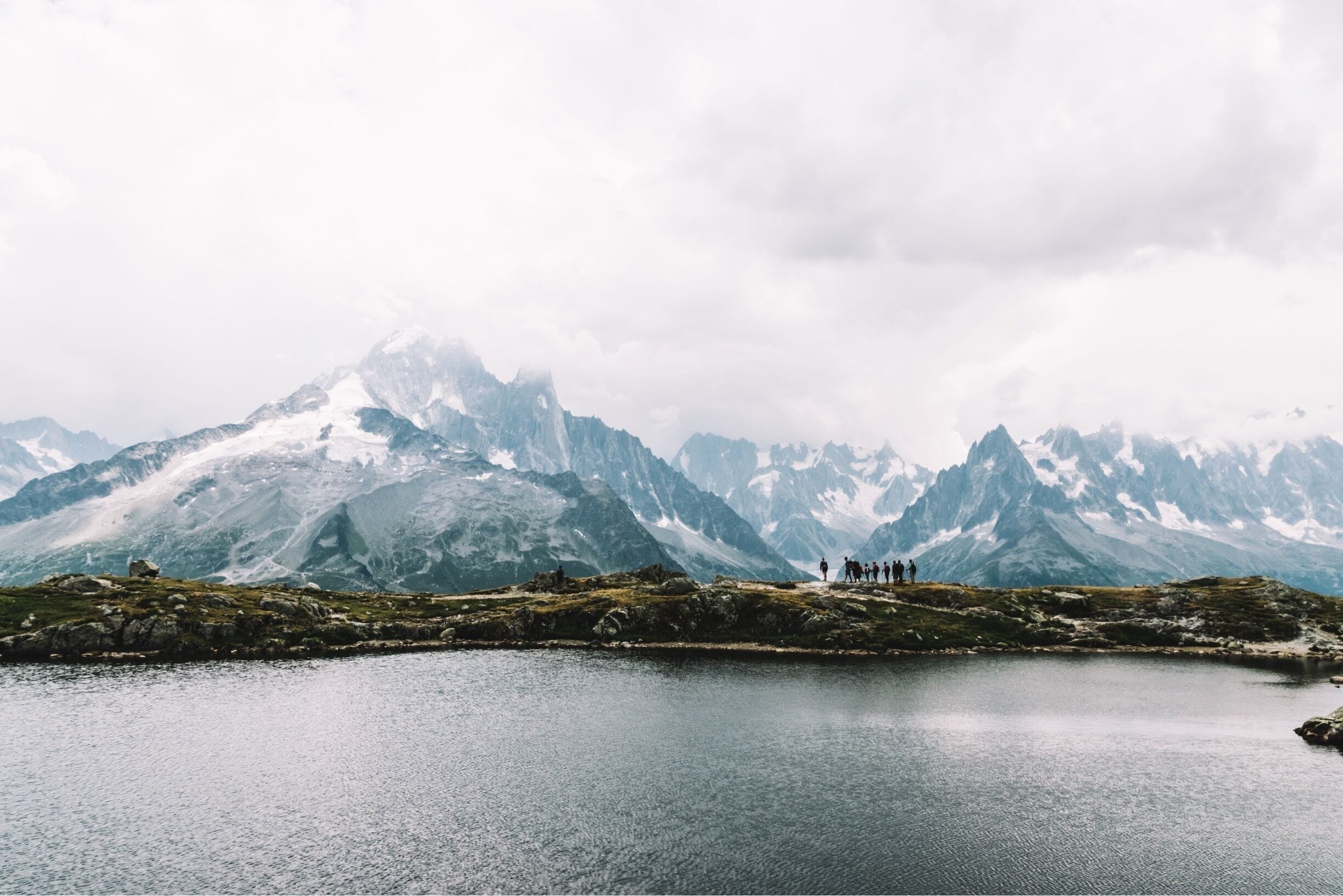 A group passing this incredible lake scenery in the french alps. Peaks rising behind this mountain pool. Have a nice day! #troveon #travel #landscape #nature #mountains #hiking

More shots on:
https://www.facebook.com/ShotByCanipel