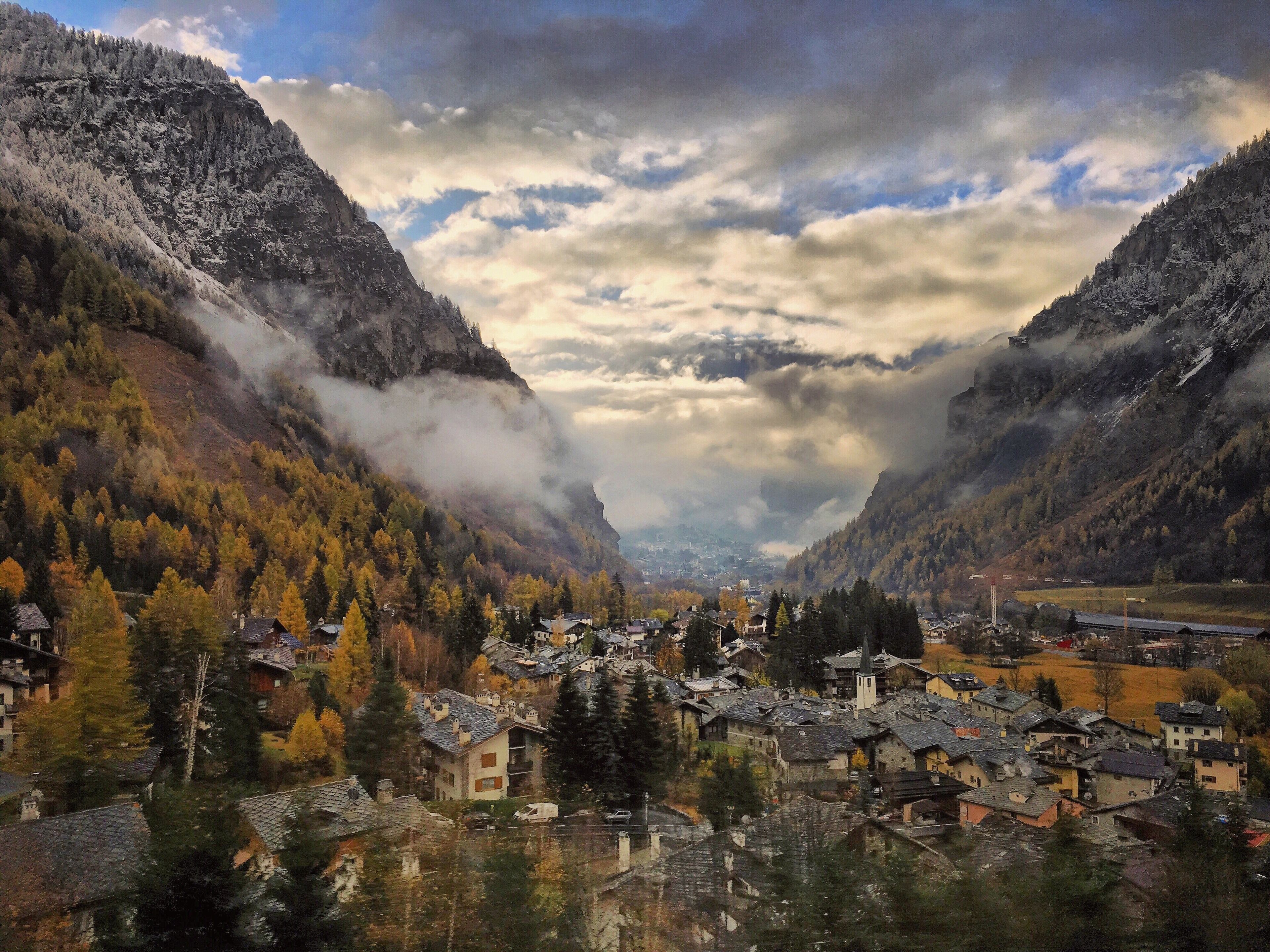 On the way to Milan Italy... The pass that leads through the Swiss Alps with a small town nestled in the arms in the base