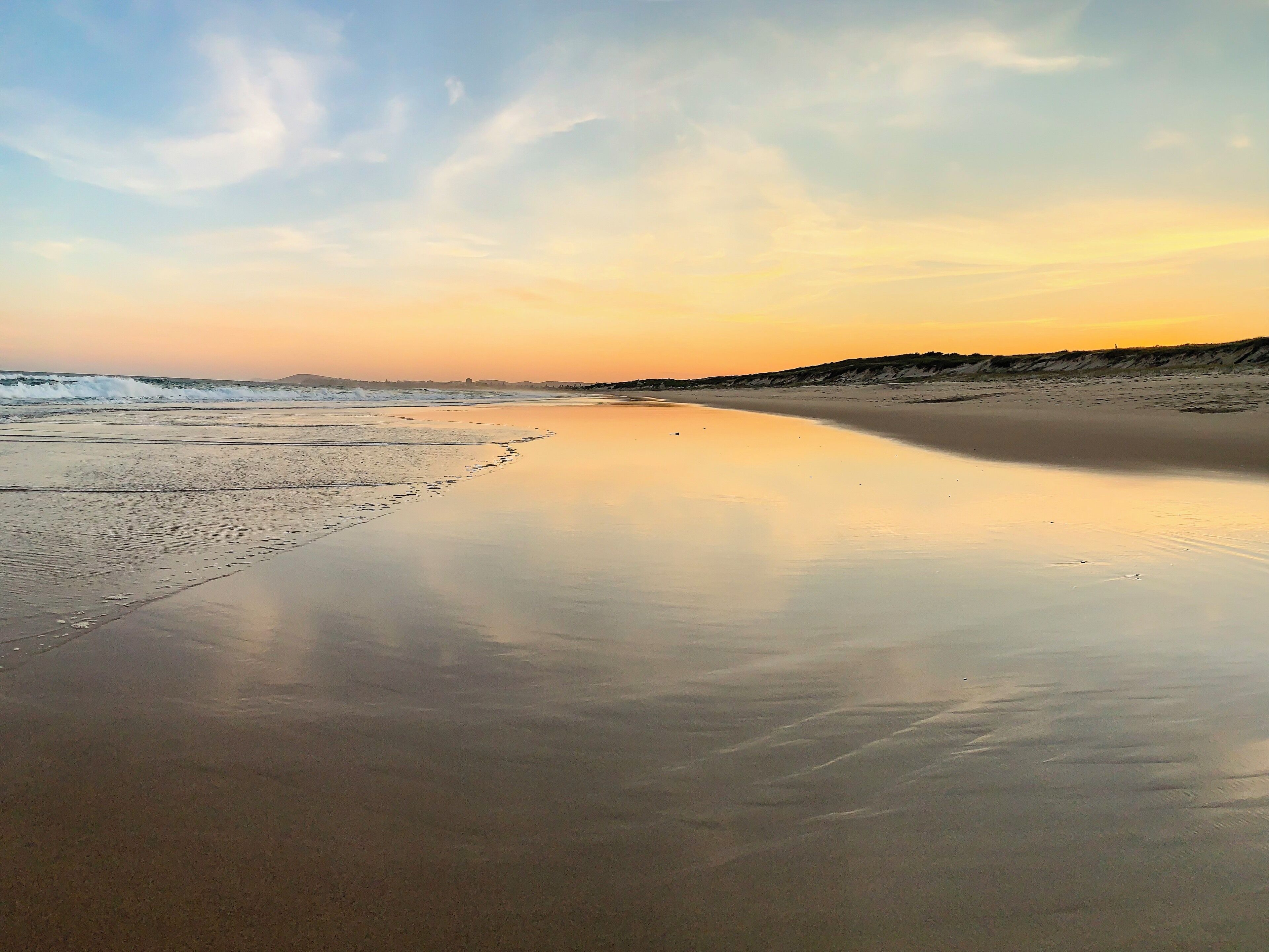 Beautiful sunset on the private and empty beach at The Pullman Magenta in Central Coast, NSW