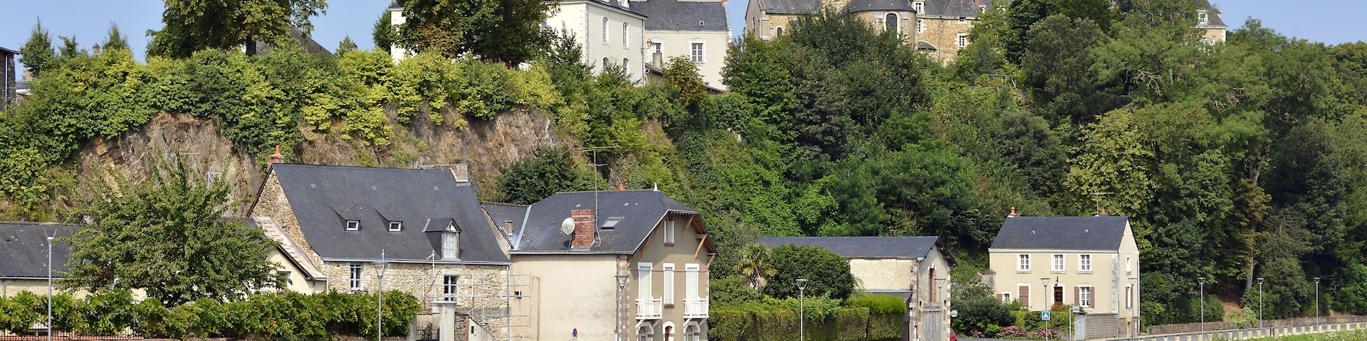 Mayenne river at Chateau-Gontier with the Saint-Jean-Baptiste church in the background, commune in the Mayenne department, Pays de la Loire Region, in north-western France; Shutterstock ID 451371142