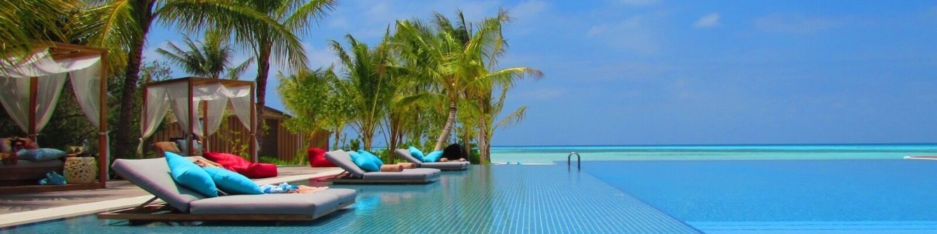 Hard to tell where the pool ends and the Indian Ocean begins.  The blues and colours are stunning.  Taken at the main pool at Club Med Finholu Villas in The Maldives.