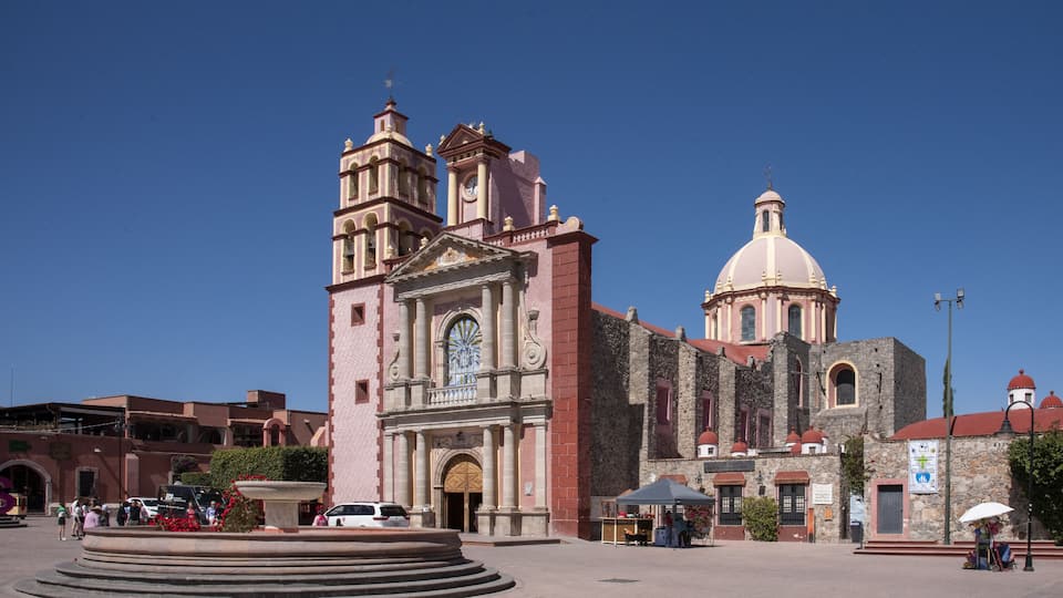 A historic church with a bell tower and a dome.