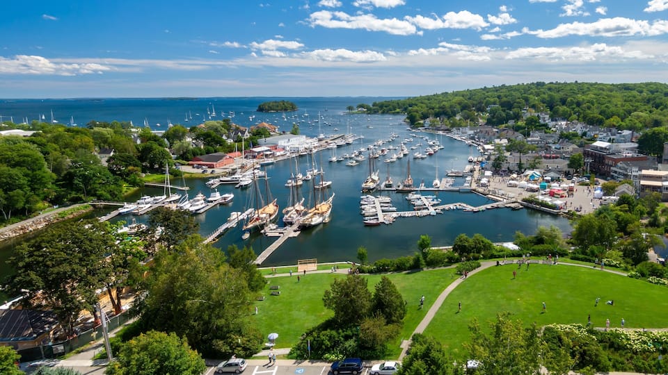 Park and Boats moored in the Camden Harbor, Camden, Maine, United States.