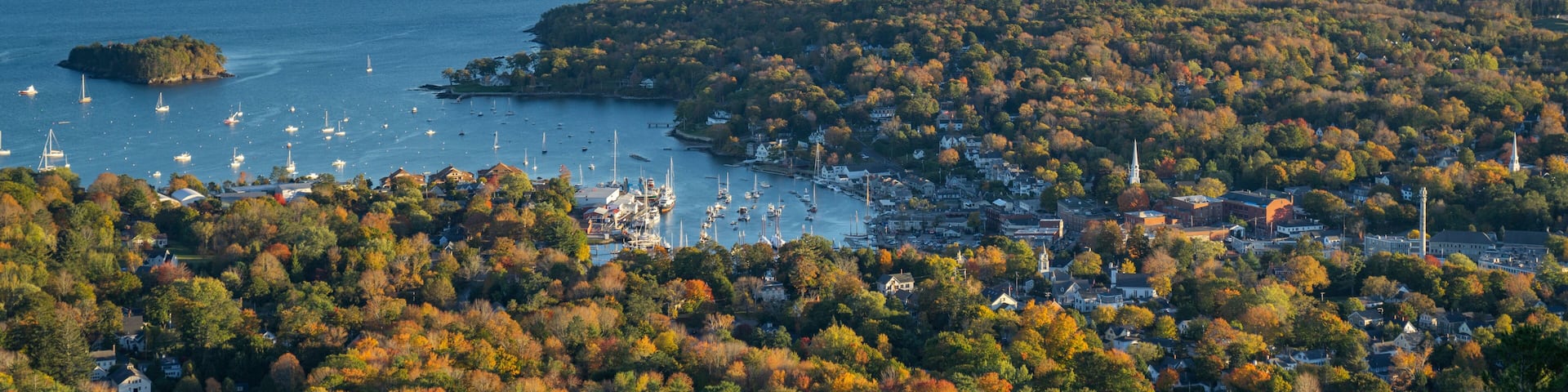 Camden, Maine coastal town on Atlantic Ocean during sunset in Autumn