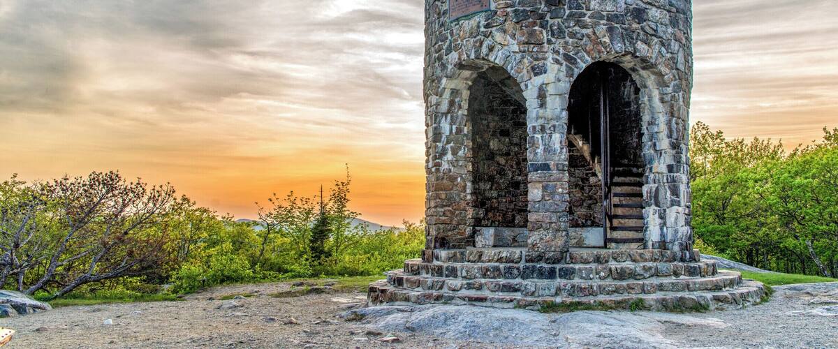 At the top of Mt Battie in Camden, Maine is this tower, constructed in 1921 as a WWI Memorial. There used to be a hotel on this site, but it was torn down in 1920. The tower was built on the site on the former hotel, and several stones from the hotel were used in the construction of the tower. There's a rather strenuous hike to the top of the mountain, but you can also drive right to the top within Camden Hills State Park. #mabattie #camden #camdenhills #maine #sunset #tower #goldenhour