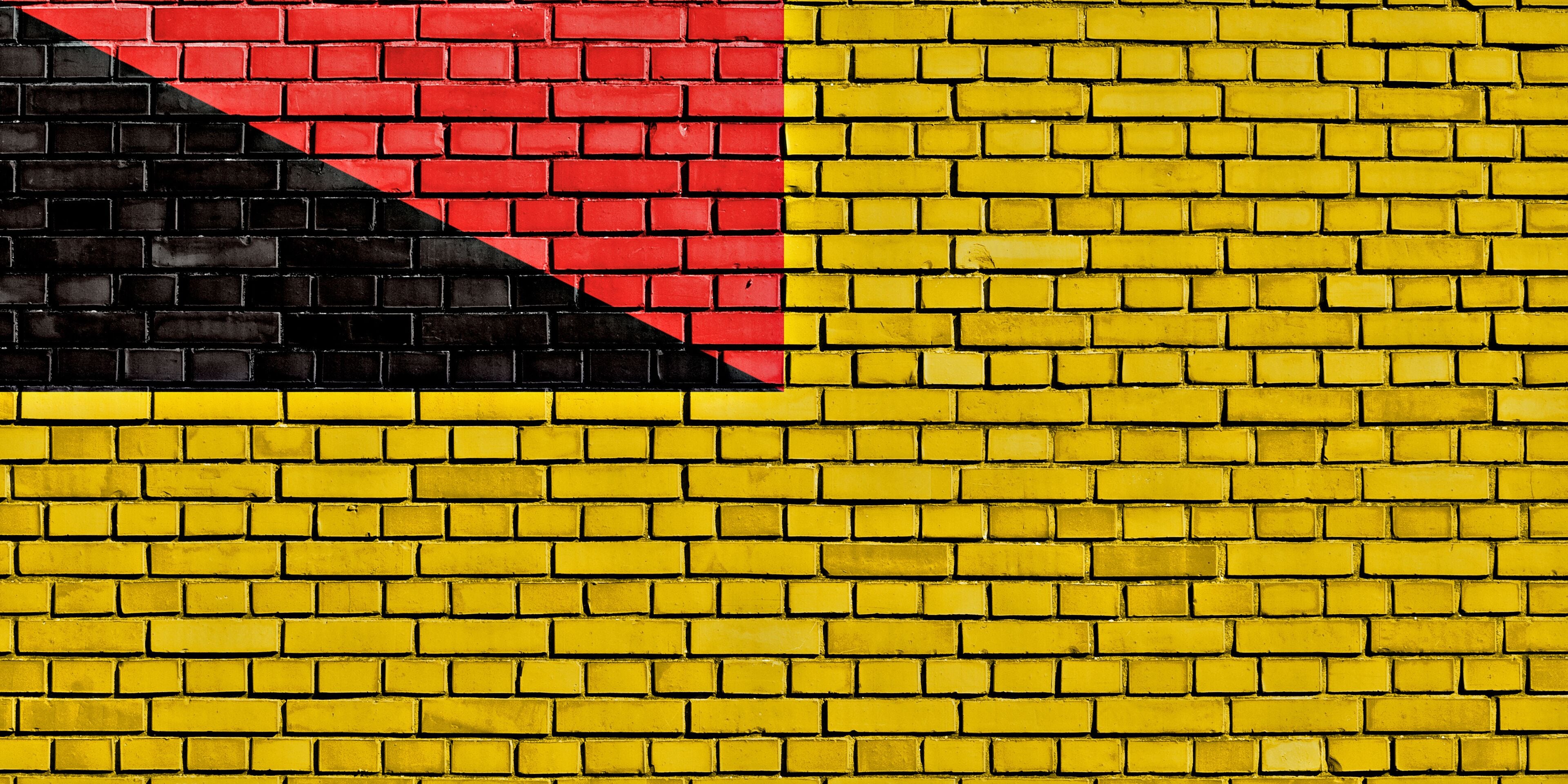 flag of Negeri Sembilan painted on brick wall