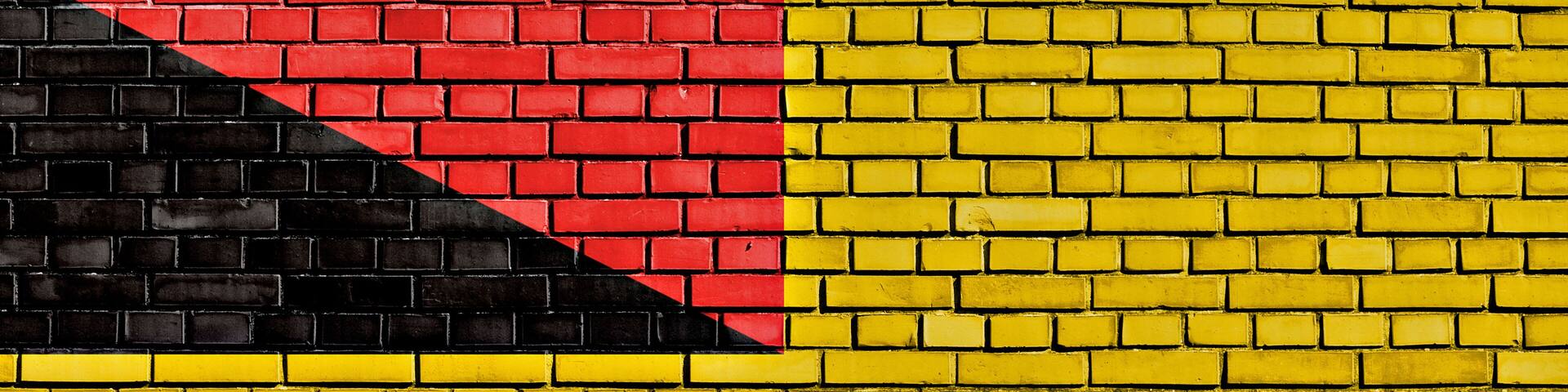 flag of Negeri Sembilan painted on brick wall