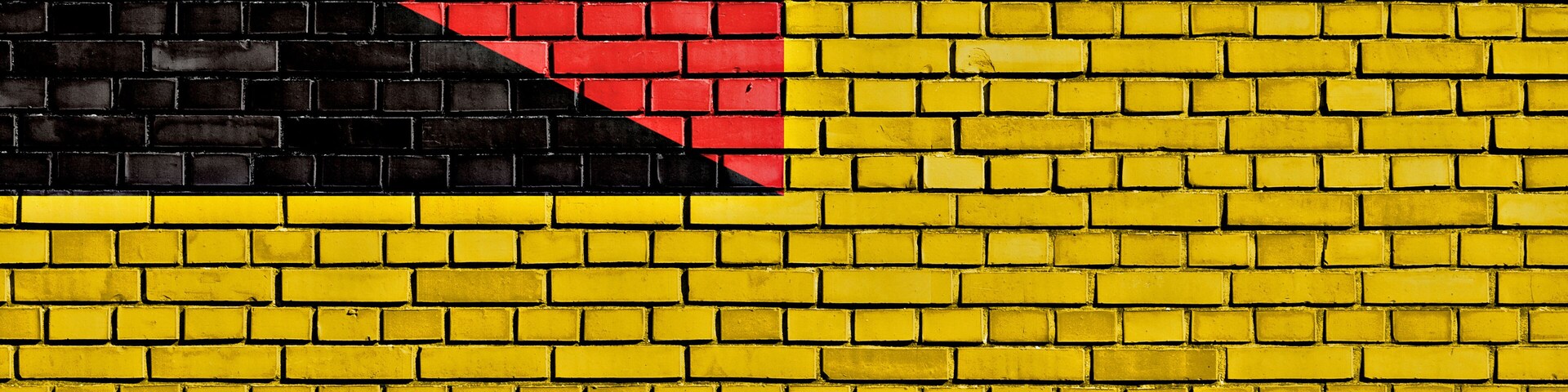 flag of Negeri Sembilan painted on brick wall