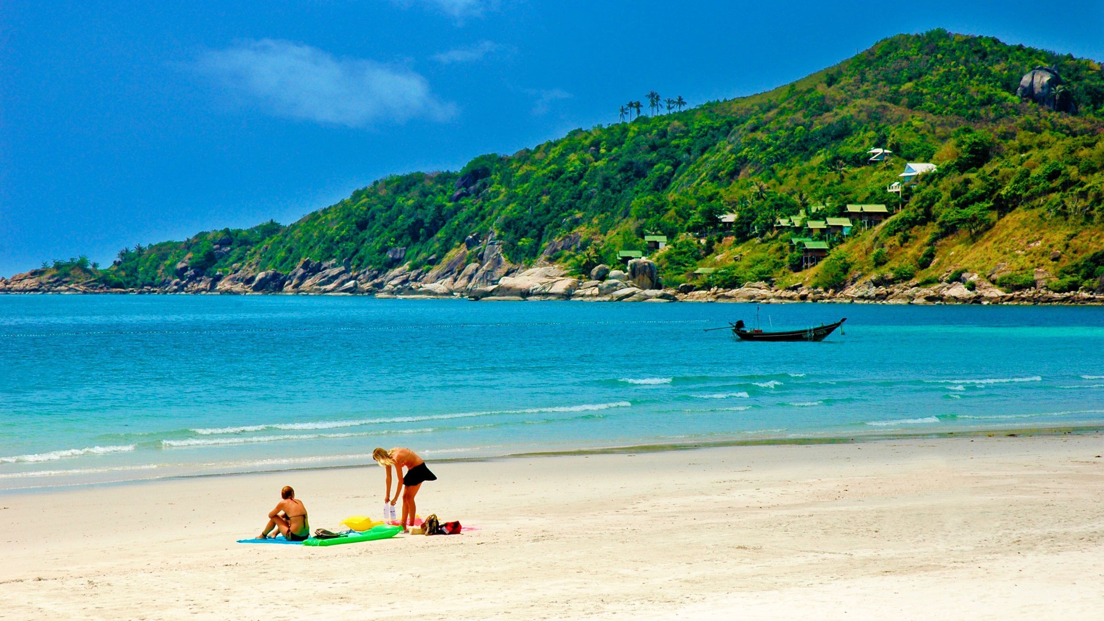 Ko Pha-ngan showing a beach and general coastal views as well as a couple
