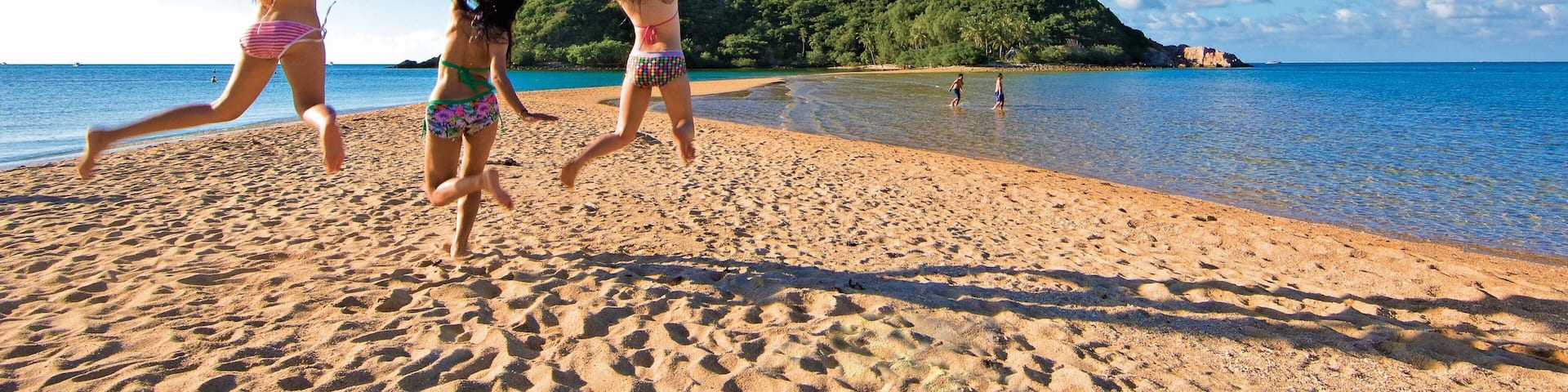 Ko Pha-ngan showing a sandy beach and general coastal views as well as a small group of people