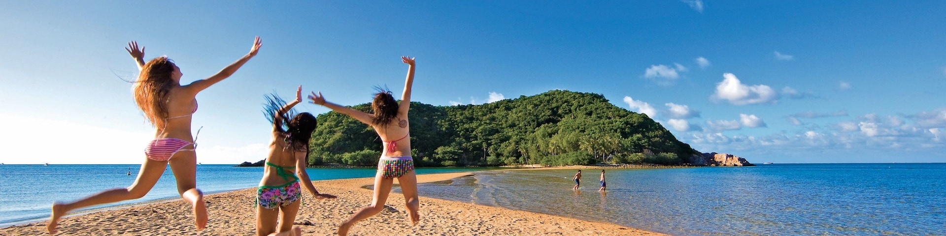Ko Pha-ngan showing a sandy beach and general coastal views as well as a small group of people