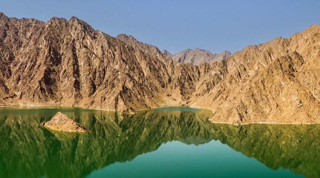Reflection of rocks in the Hatta dam lake in the Dubai