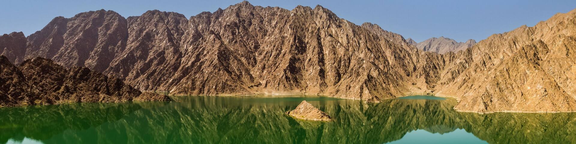 Reflection of rocks in the Hatta dam lake in the Dubai