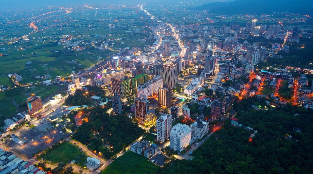 Aerial view of the high-rise buildings and hotels at blue dusk in Downtown Jiaoxi, which is a famous hot spring resort and tourist destination in Yilan County, Taiwan, on a cloudy moody evening