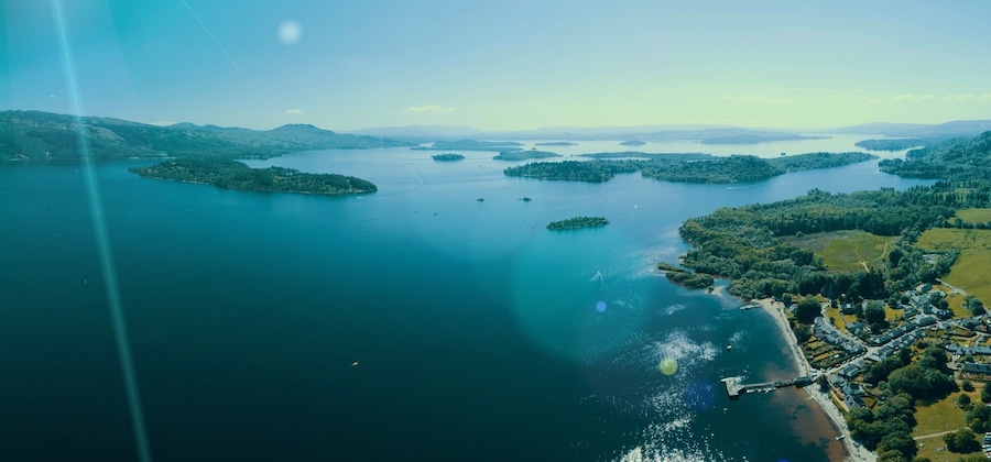 The Lodge on Loch Lomond is a wedding favourite but also a nice spot in hot days for water sports. This is looking south towards Dumbarton.