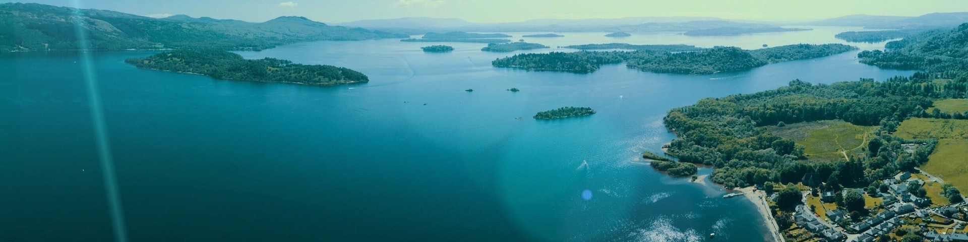 The Lodge on Loch Lomond is a wedding favourite but also a nice spot in hot days for water sports. This is looking south towards Dumbarton.