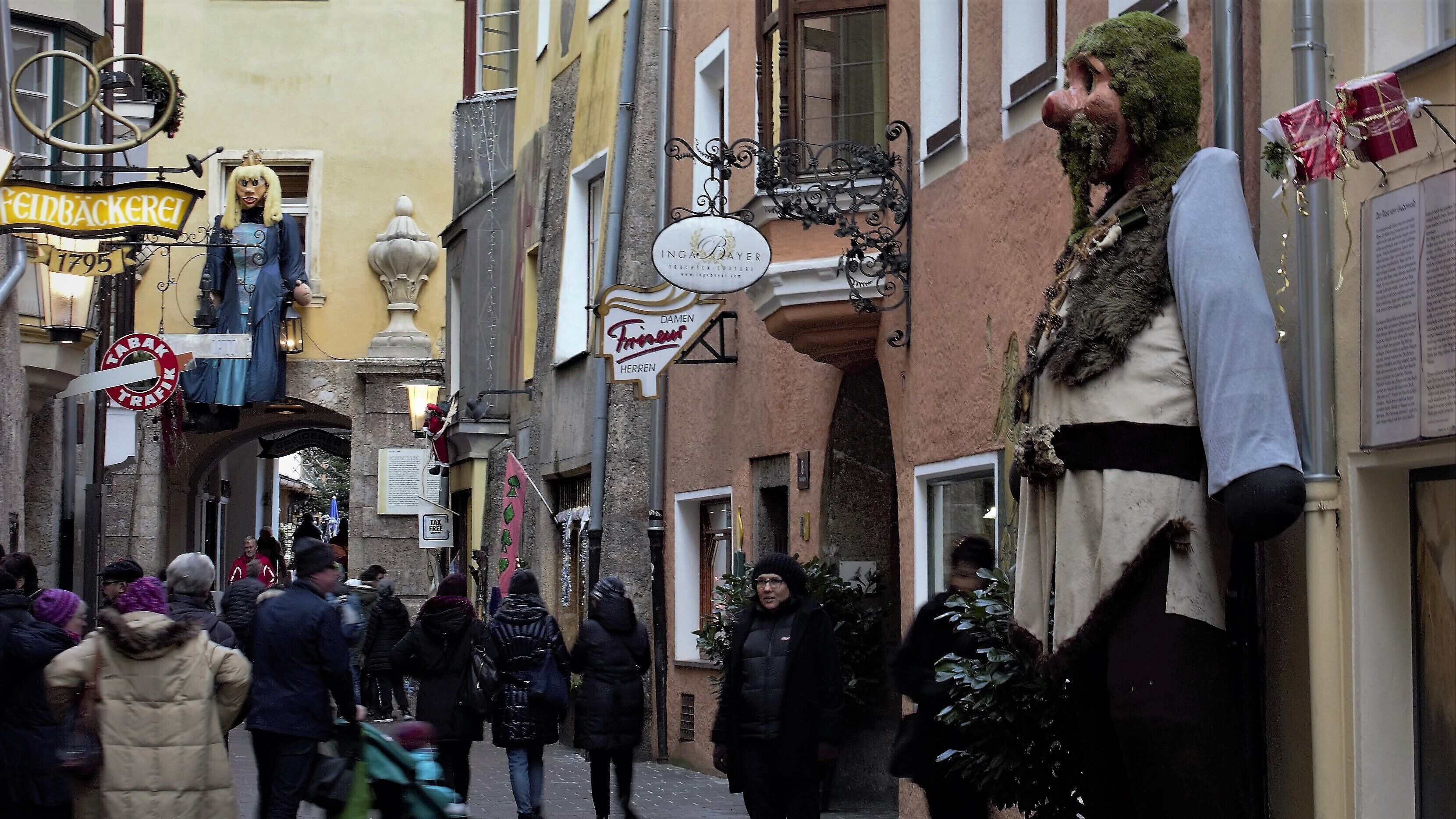 Giant dolls on the street at the Hofgasse, Innsbruck, Austria.