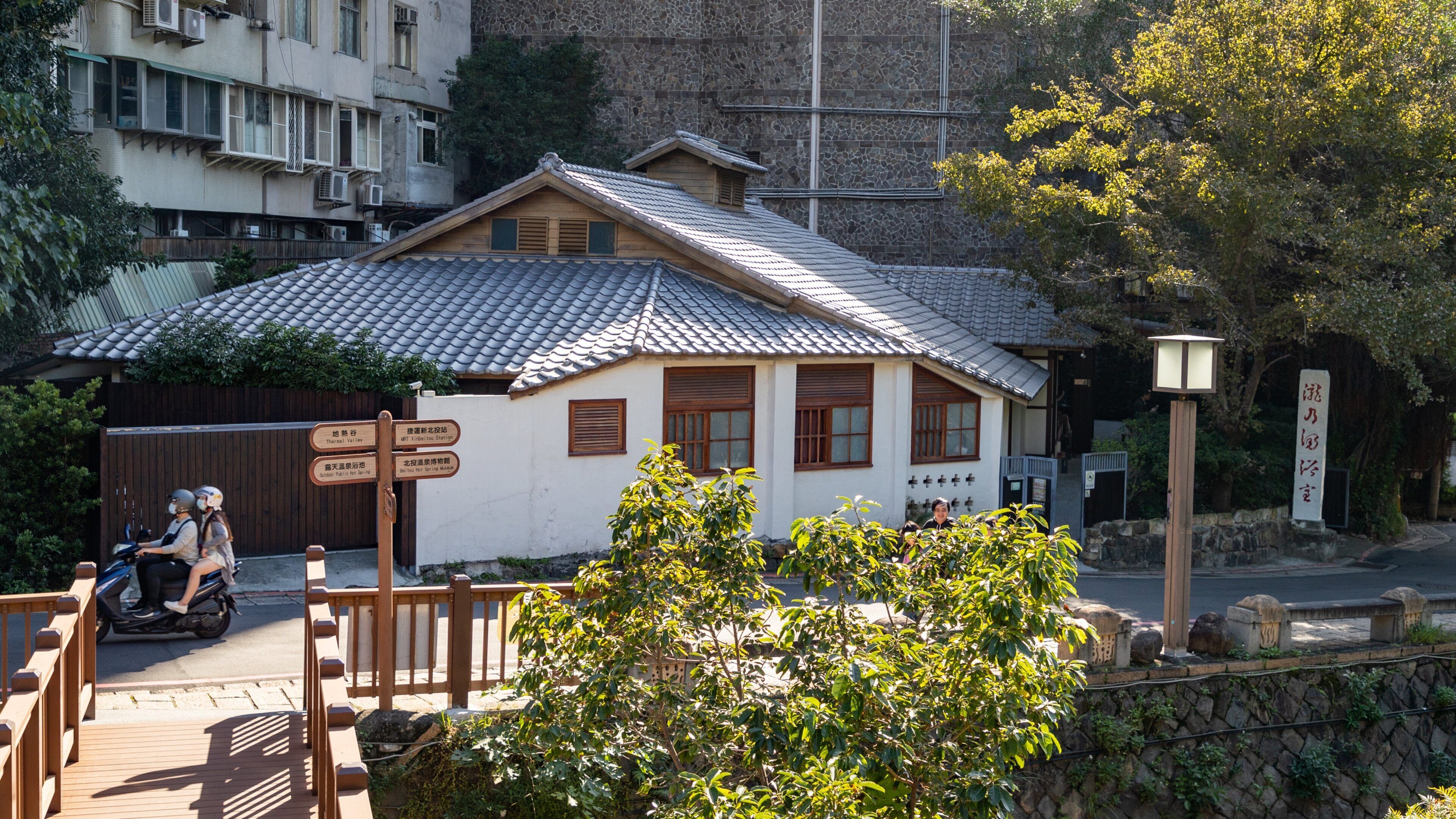 Beitou showing motorbike riding as well as a couple