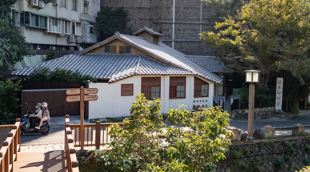 Beitou showing motorbike riding as well as a couple