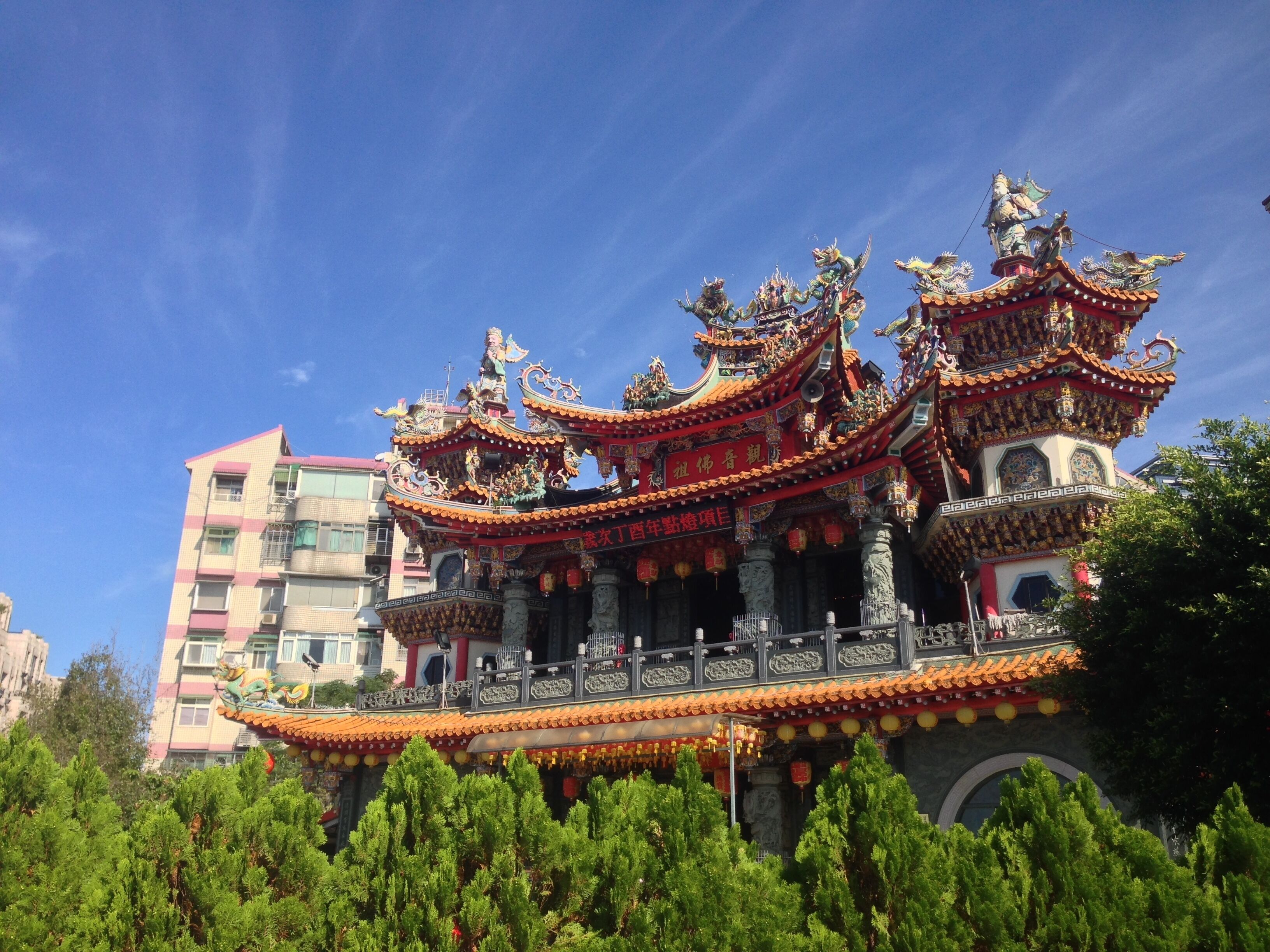 A traditional Chinese temple with ornate architecture, including multiple tiers and colorful decorations.