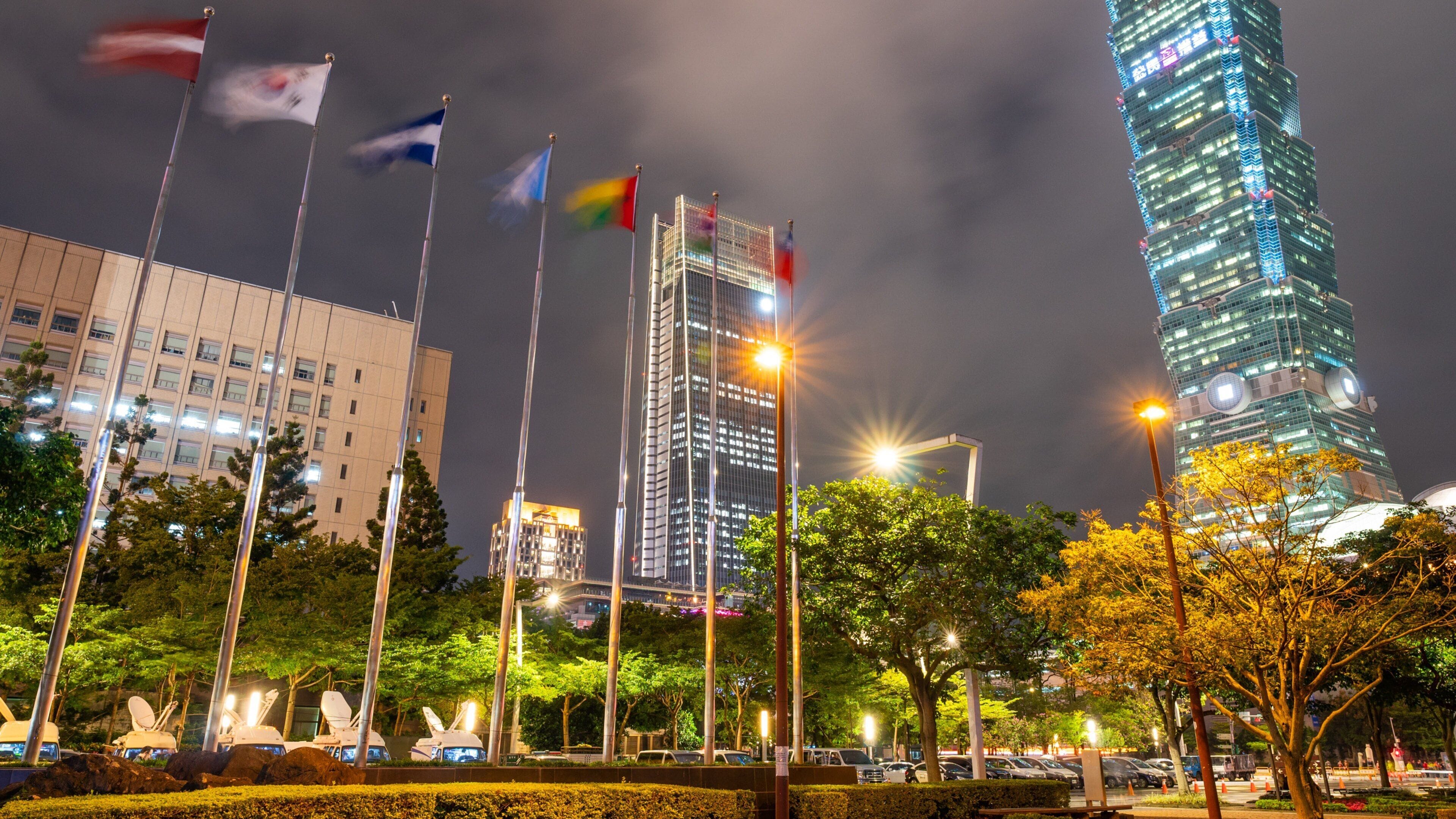 Xinyi which includes night scenes, a city and a high rise building