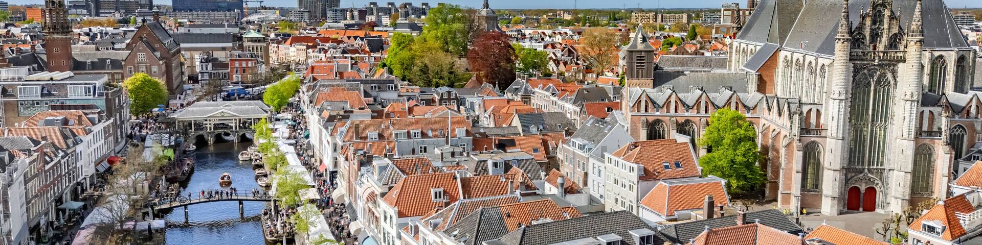 Leiden town aerial drone view from above, typical Dutch city skyline with canals and houses, Leiden architecture, South Holland, the Netherlands