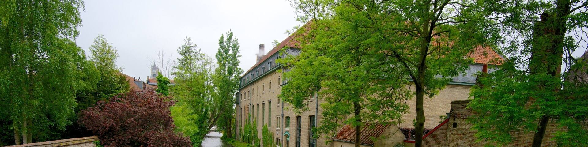 Flemish Region showing a river or creek and boating as well as a small group of people