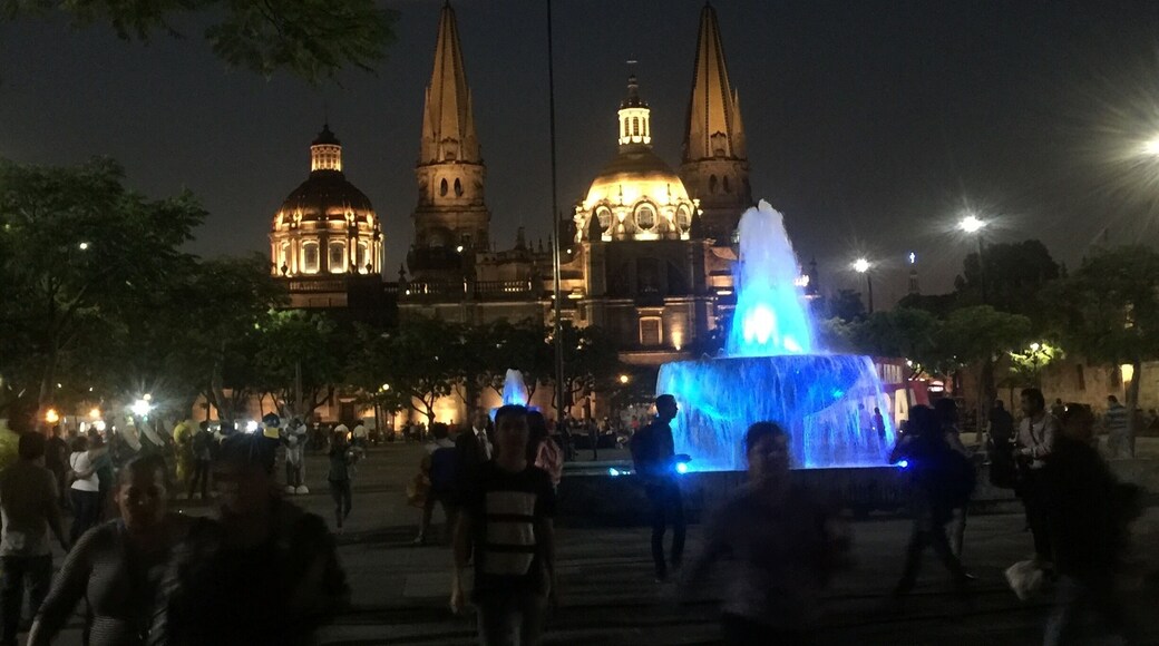 Guadalajara 's plaza with shops, museum, and church. Wonderful place for a stroll eating an ice cream or drinking some coffee from the local coffee shop.