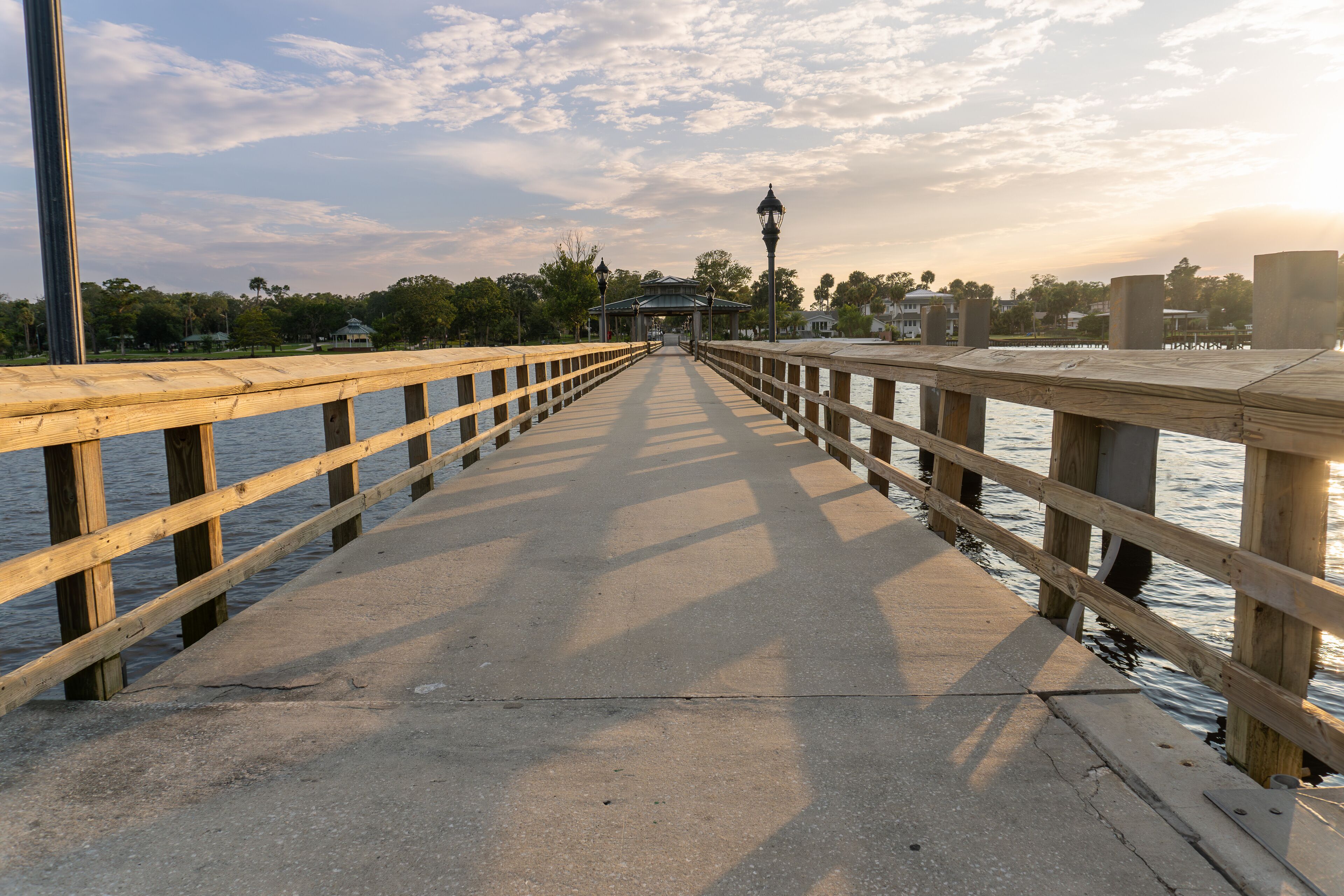 Green Cove Springs Public Pier in Green Cove Springs, Florida. Fishing pier and boat dock on the St. Johns River. Sunset, covered pavilion, boat slips, Jacksonville area, Clay county. 