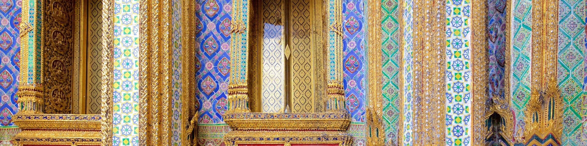 Ornate temple architecture with intricate blue and gold patterns and detailed carvings.