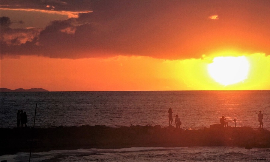 It looks as if ‘the great ball of fire’ is being pushed into the sea by the clouds.  #Trovember