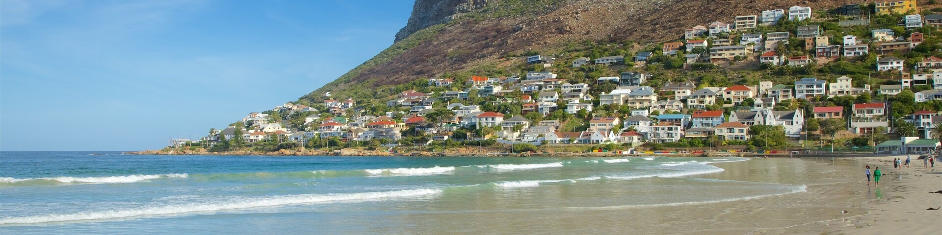 Fish Hoek which includes general coastal views, a coastal town and a sandy beach