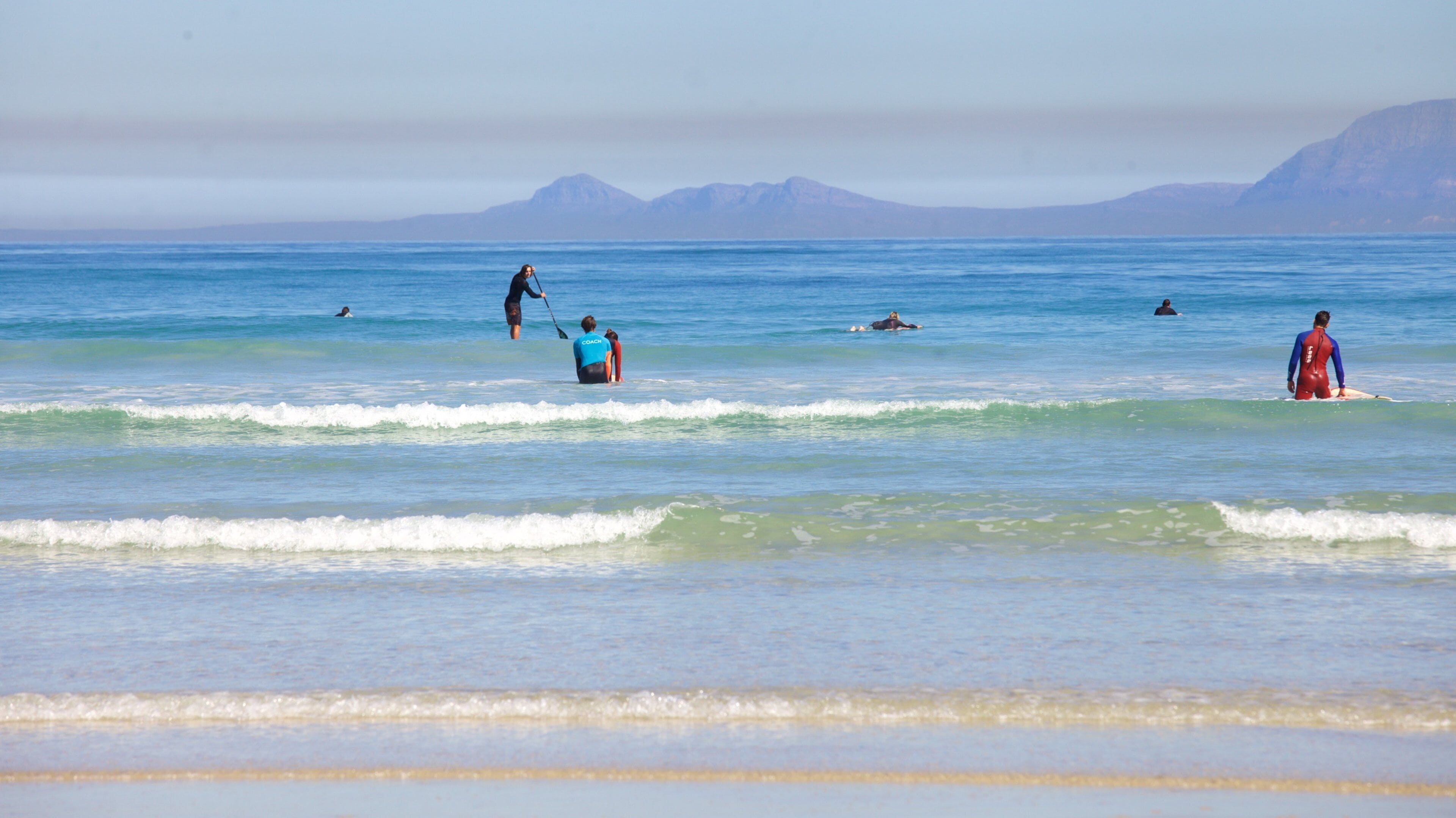 Strand featuring landscape views, a coastal town and a sandy beach