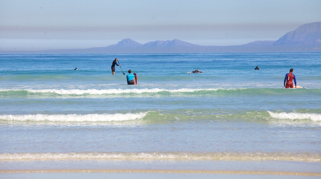 Strand featuring landscape views, a coastal town and a sandy beach