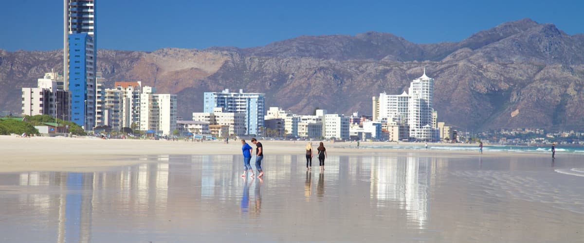 Strand featuring a city, a beach and a coastal town