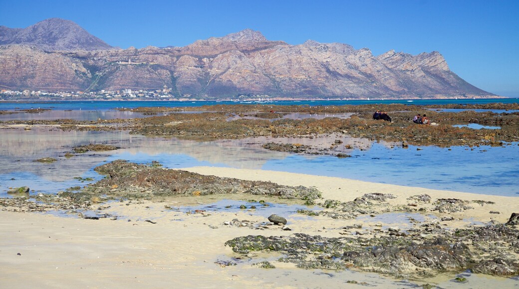 Strand which includes general coastal views, landscape views and mountains