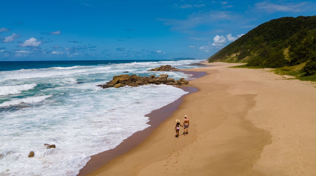 St Lucia South Africa, men and woman walking at the beach Mission Rocks beach near Cape Vidal in Isimangaliso Wetland Park in Zululand. South Africa St Lucia