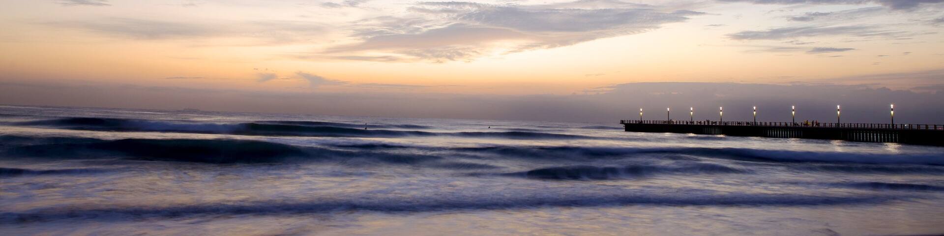 Kwazulu-Natal showing a sunset, night scenes and a sandy beach