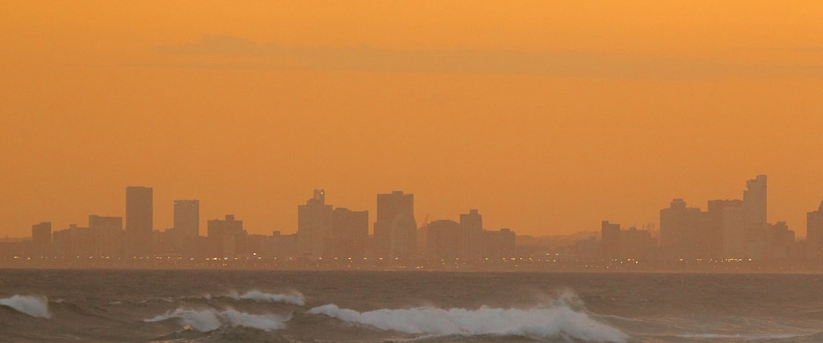 Kwazulu-Natal featuring a sunset, a city and a skyscraper
