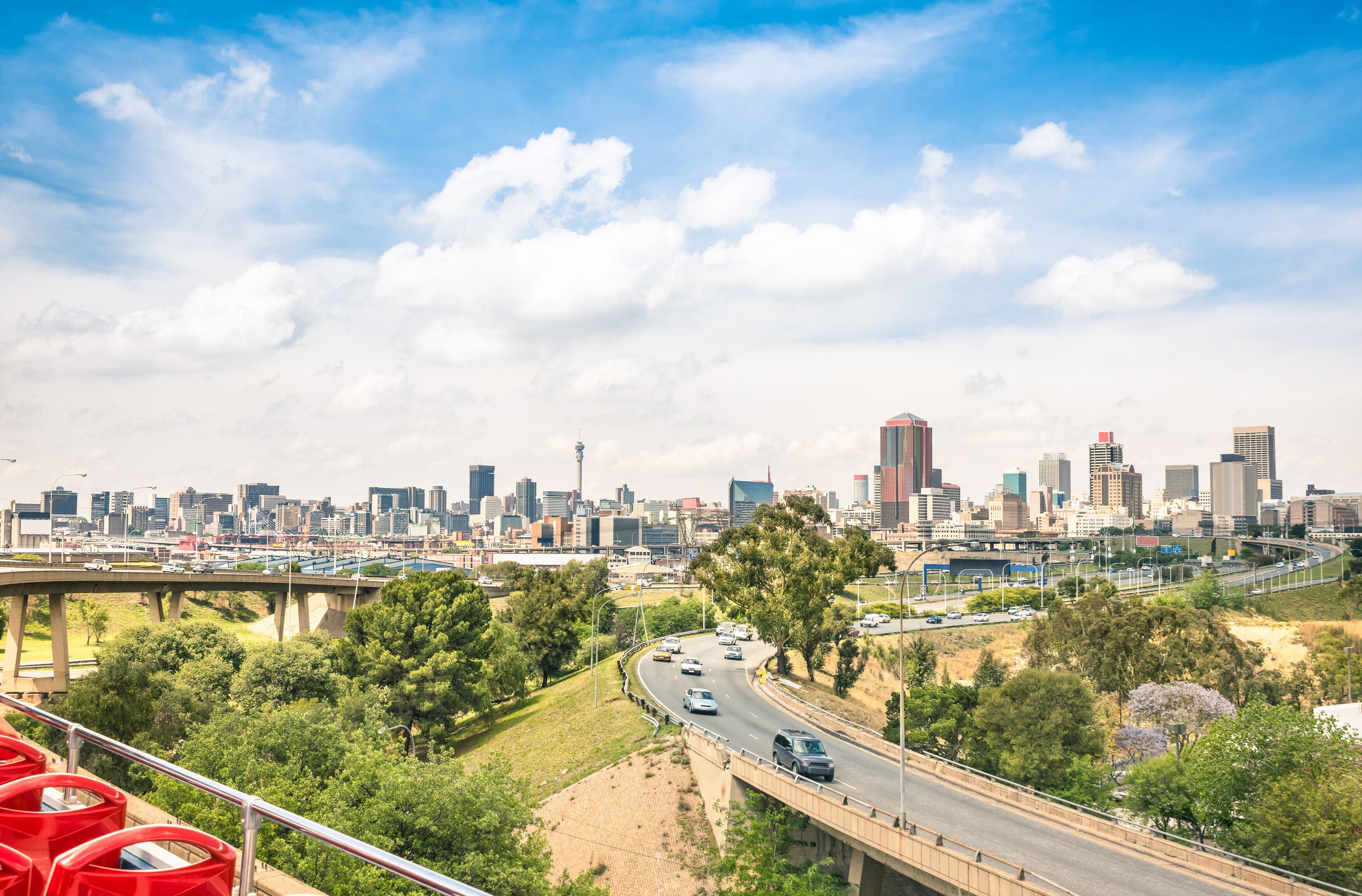 A city skyline with a bridge and highway.