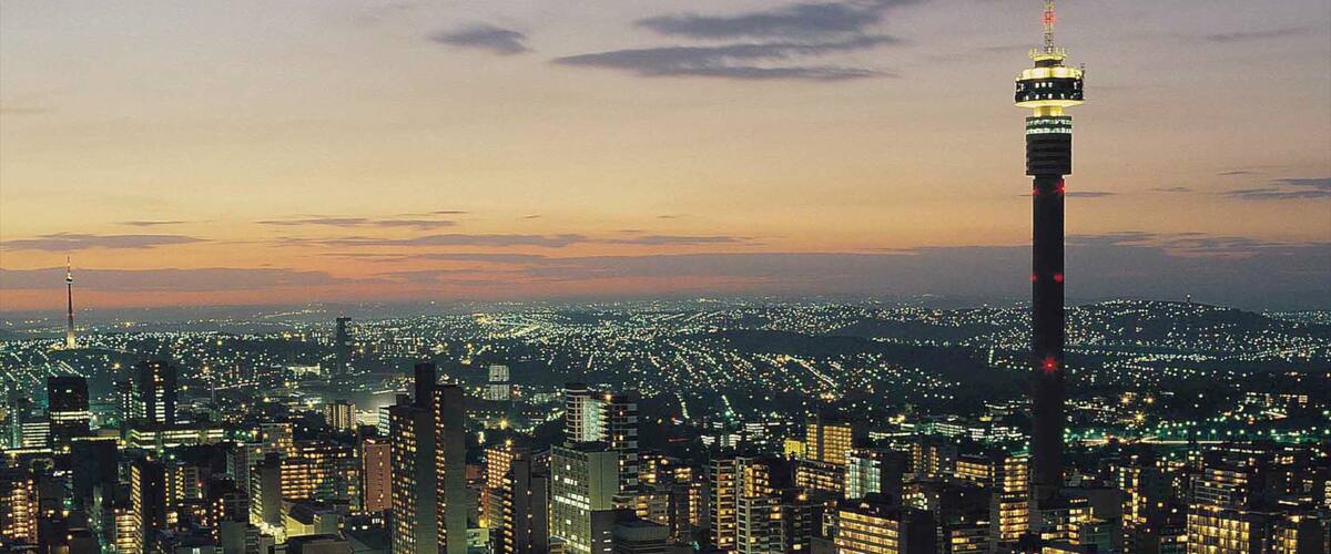 Johannesburg - Gauteng which includes a city, a sunset and skyline