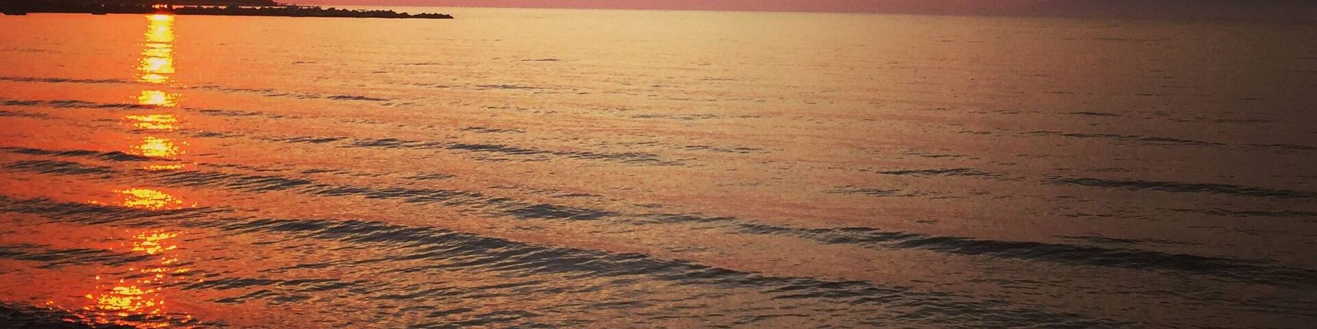 A view from are hotel in Corfu at sunset. With the mountains of Albania only a few miles across the Mediterranean Ocean.